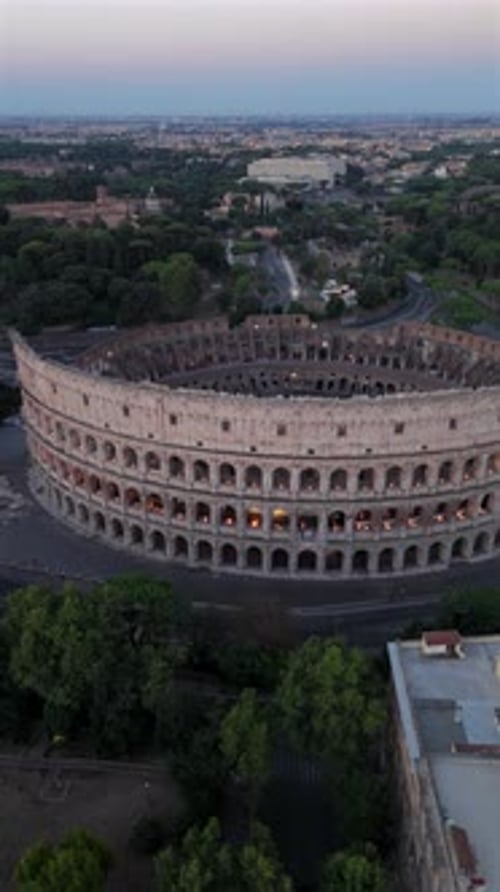 Witness the Breathtaking Aerial Views of the Majestic Colosseum in Rome As Night Falls