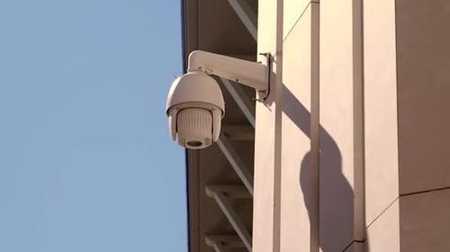 Dome Security Camera Mounted on Building Exterior