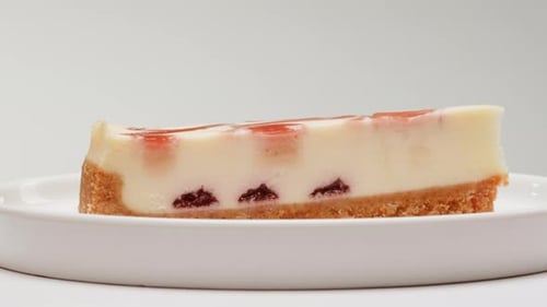 Slice of Strawberry Cheesecake on a Plate