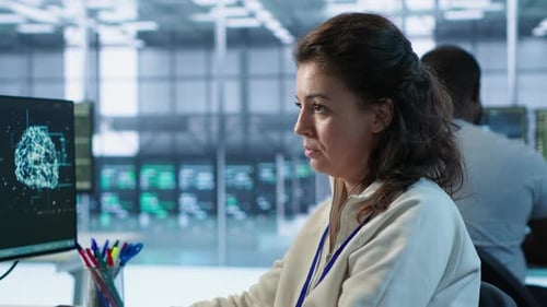 Woman Working With Brain Scan in Tech Office