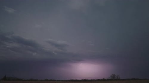 Lightning Strikes Over Rural Landscape at Night