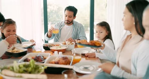 Family Sharing Meal Together at Home