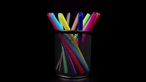 Colorful Markers Rotating on a Black Background