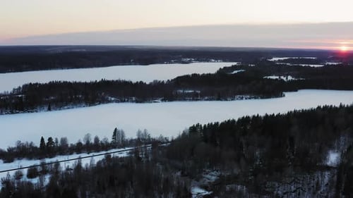 Aerial View the Magical Atmosphere of a Winter Sunset Over a Coniferous Forest