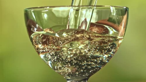 Sparkling Liquid being Poured into a Glass