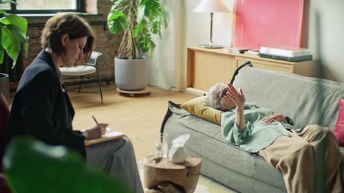 Senior Woman Lying on Couch Talking to Therapist