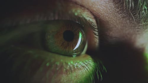 Intense Eye Close-Up with Green Light