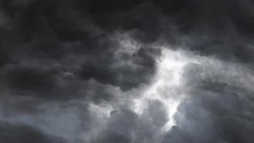 a bolt of lightning on the gray cloud moving in the sky.