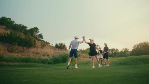 Friends Play Golf on a Sunny Day