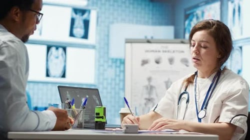 Doctor Giving Prescription to Patient in Bright Office
