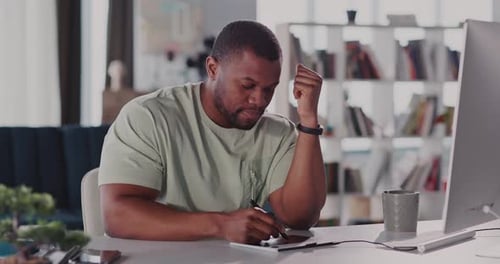 A Thoughtful and Professional Individual Engaged in Work Within a Modern Office Setting