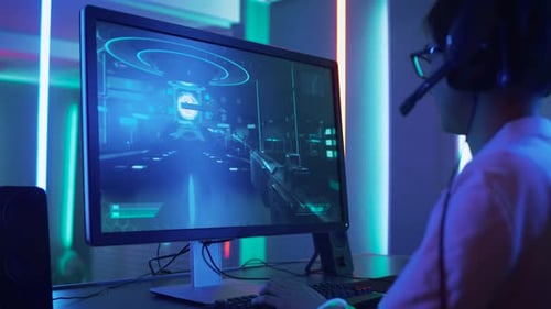 Focused Man Playing First-Person Shooter Video Game