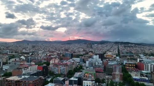 City skyline with sunset mountains