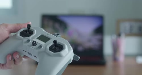 Close Up of Hand Holding Drone Controller