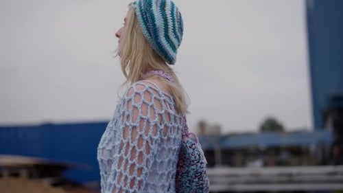 Stylish Woman Walking in an Industrial Area