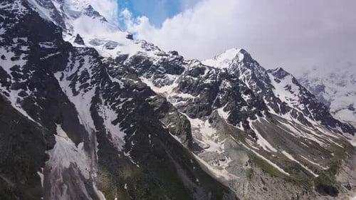 Fantastic Mountain Scenery of Snowcovered Alpine Sharp Peaks Aerial View