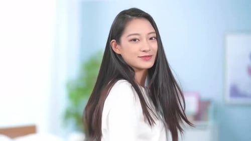 Smiling Woman with Long Hair Indoors