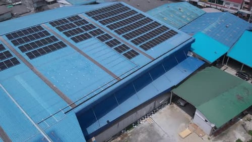 Aerial view of solar cell panels installed on roof of the factory. Go green save the planet earth
