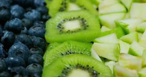 of fresh fruit mix composition, with strawberry, apple,blueberry,raspberry,kiwi, orange. Salad of