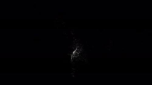 Abyss Collection: Effect of a small splash above the surface of water over a black background