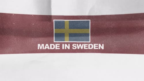 Made in Sweden Flag and Text Reveal on Crumpled Paper