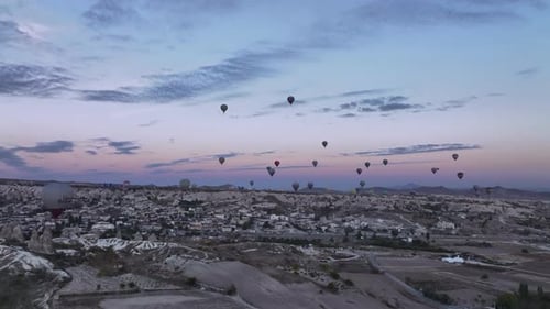 Hot Air Balloons Over Turkish City at Sunrise