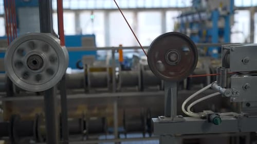 Cable production process, mechanism in a cable factory. Industrial background with spinning