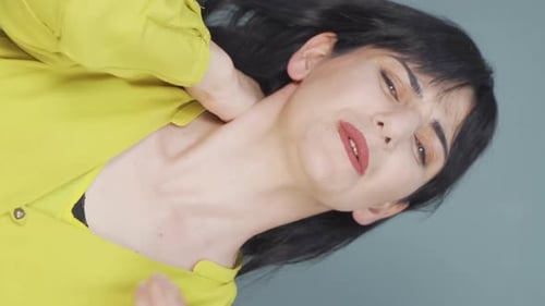Woman Massaging Neck in Close Up