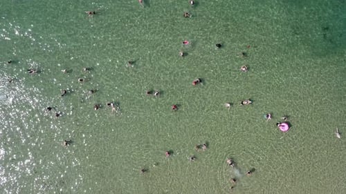 Crowd of People enjoying the cool waters of The Mediterranean Sea