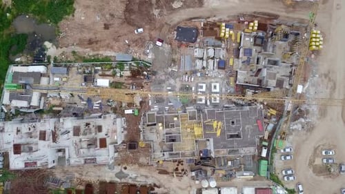 Large residential construction site with cranes, Aerial view
