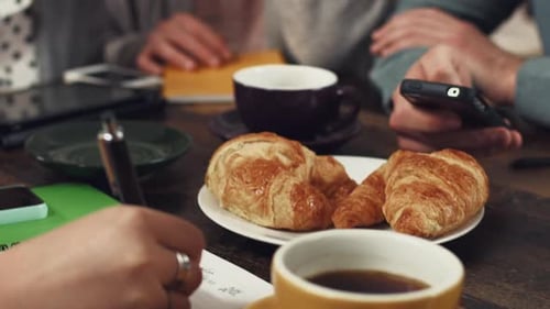 Hands, collaboration and business people meeting at breakfast for planning