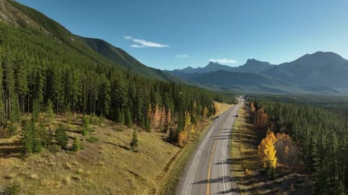 The road in the mountain valley. Travelling by car. Landscape from the air.