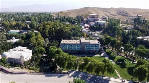 houses in the middle of the mountain drone frame