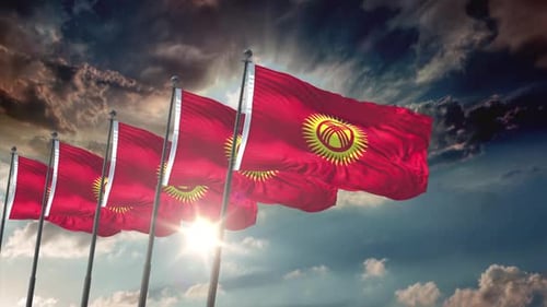 Waving Flags of Kyrgyzstan Against a Dramatic Sky