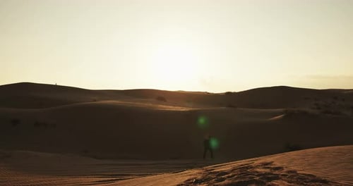 Man Walking Alone in Desert – Cinematic Landscape in Middle East