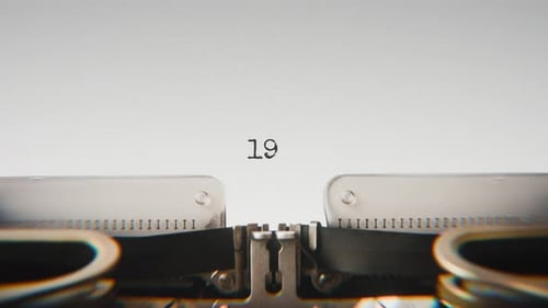 Old mechanical typewriter typing Year 1935 in a close-up view.