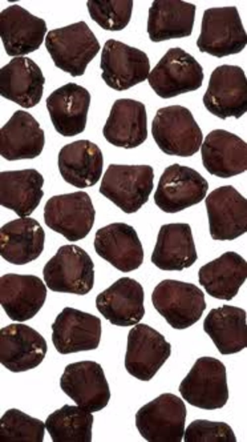 Vertical Falling Chocolate Muffins on White