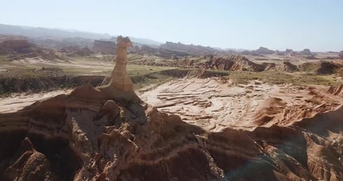 aerial drone shot camel shape wind erosion rock cliff formation hoodoo erosion in desert mountain cl