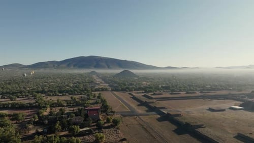 Drone Shot Of Teotihuacan City of Gods, Aztec Pyramids, Hot Air Balloons In Background, Mexico