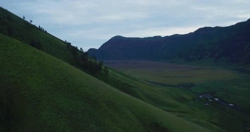 Aerial Drone View of Green Hills in Bromo Mountain Landscape