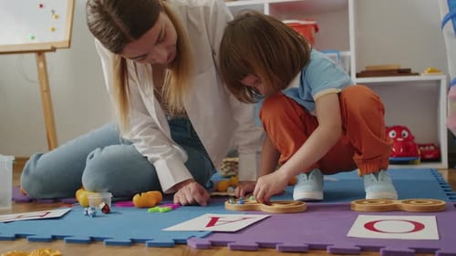 Teacher and Child Engaging with Educational Toys
