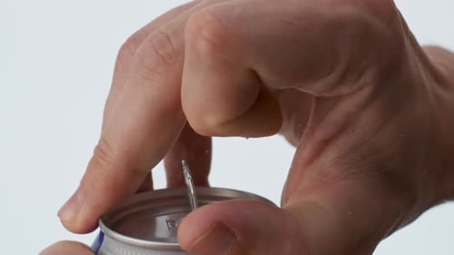 Opening Refreshing Soda Pop Can in Close Up