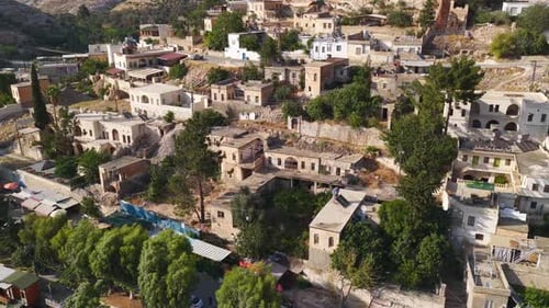 Aerial Video of Old City Beside River in Desert Landscape