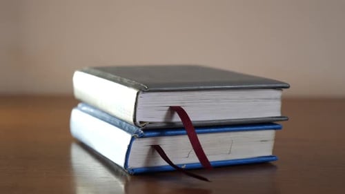 K125. Business diaries for 2021, 2020 and other years. Business laptops stacked on top of each other