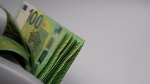 Euro Bills Being Counted by Mechanical Counter