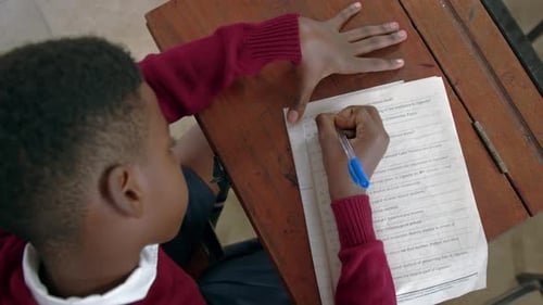Student Studying For An Exam In African School - High Angle Shot