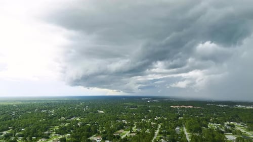 Landscape of Dark Ominous Clouds Forming on Stormy Sky Before Heavy Thunderstorm Over Rural Town