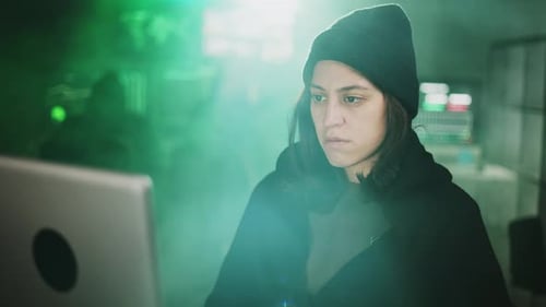 Young Adult at Computer in a Dark Room