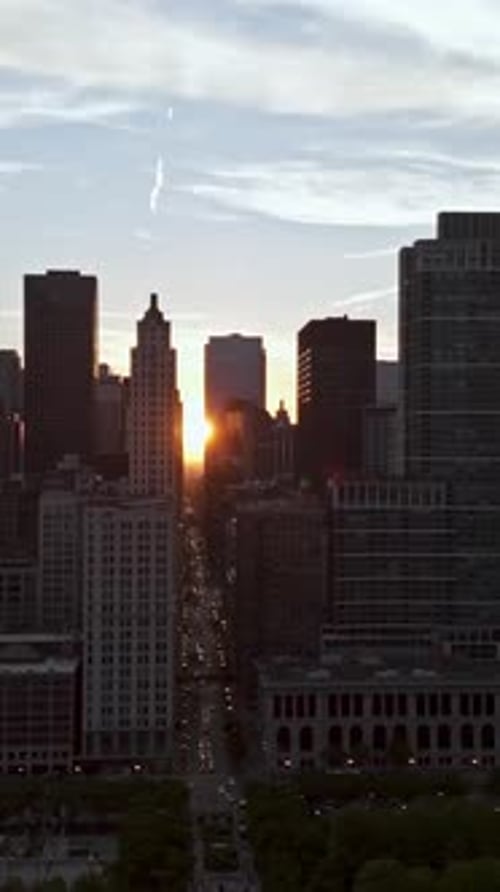 Vertical drone shot of the Chicagohenge equinox in middle of high-rise of Chicago
