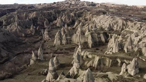 Aerial video of a panoramic view of natural rock formations in Cappadocia, Turkey
